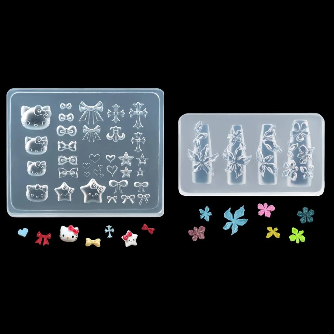 Two clear silicone molds with various shapes on a black background